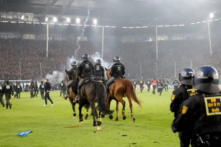 What we know about Fans and police injured in pitch invasion during ‘high risk’ German Cup